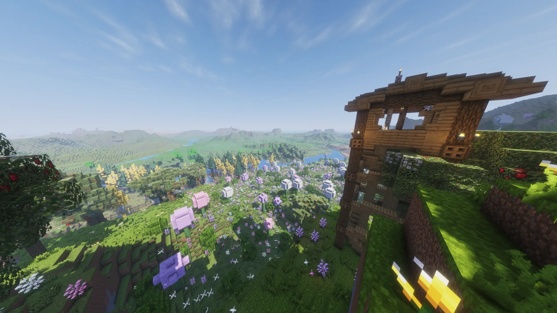 An elevated Minecraft² home overlooking a bright flowering valley.