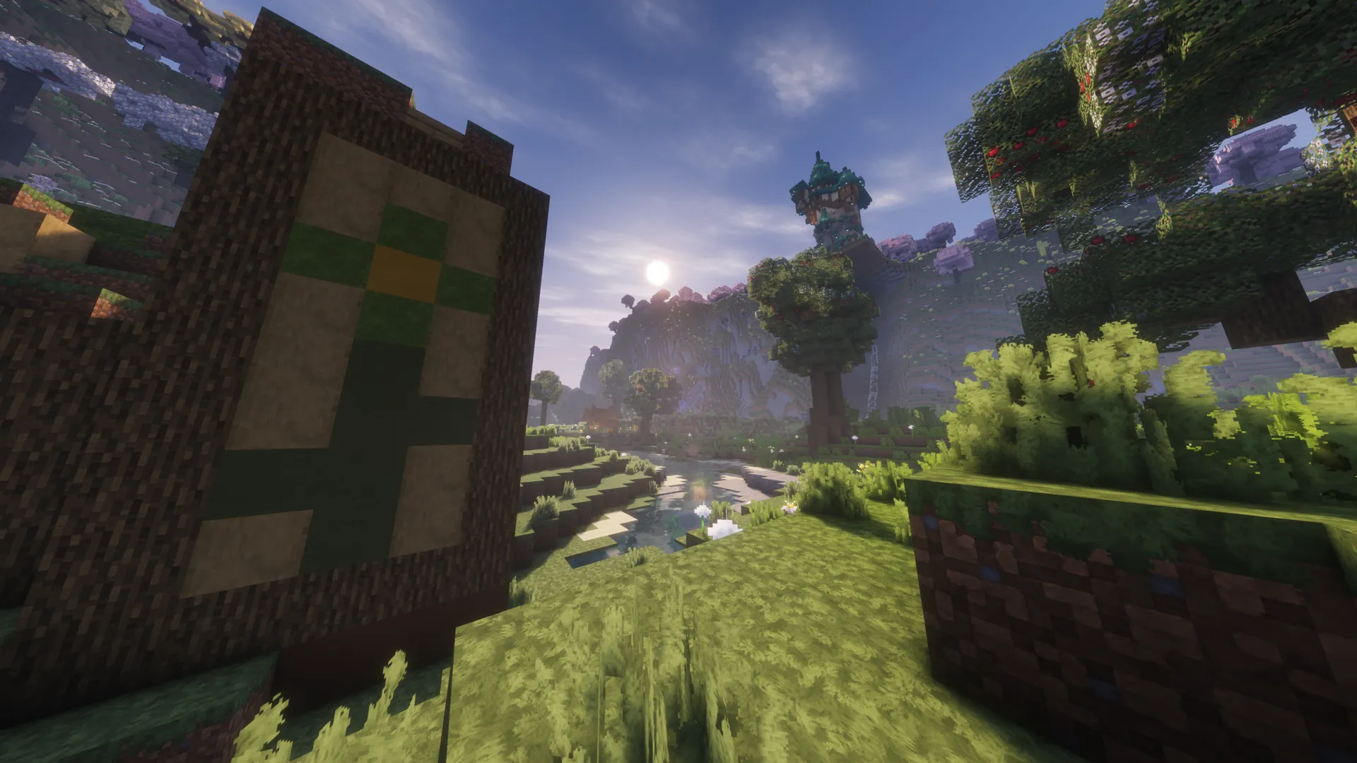 A Minecraft² banner and distant tower beside a sunlit stream.