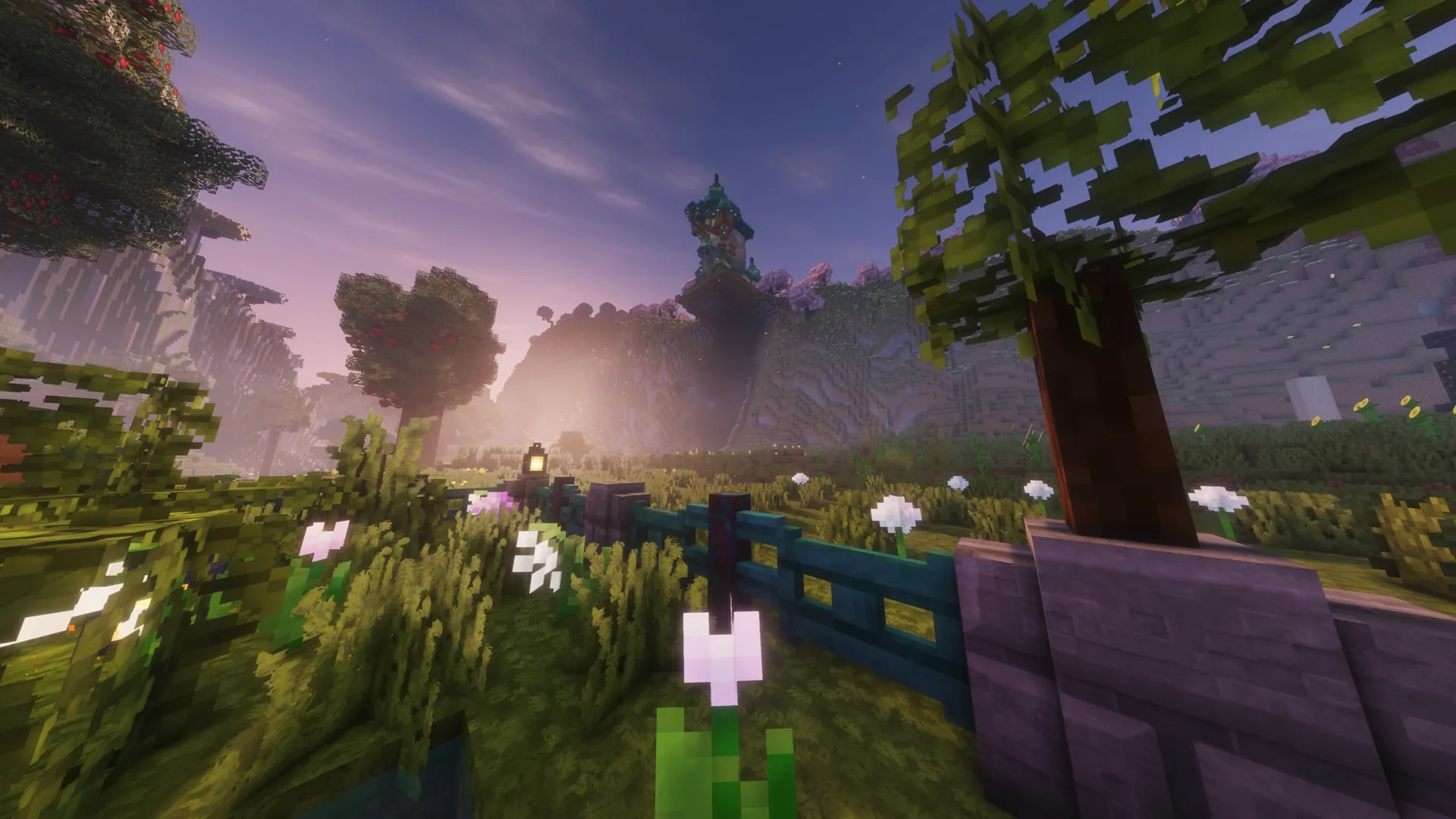 A tower rising above a lush Minecraft² valley at dusk.